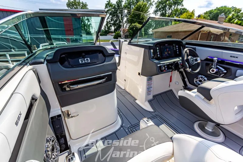 Slide: The Image of Interior of 2026 Chaparral SSX 6 boat, featuring modern dashboard and seating. - 21