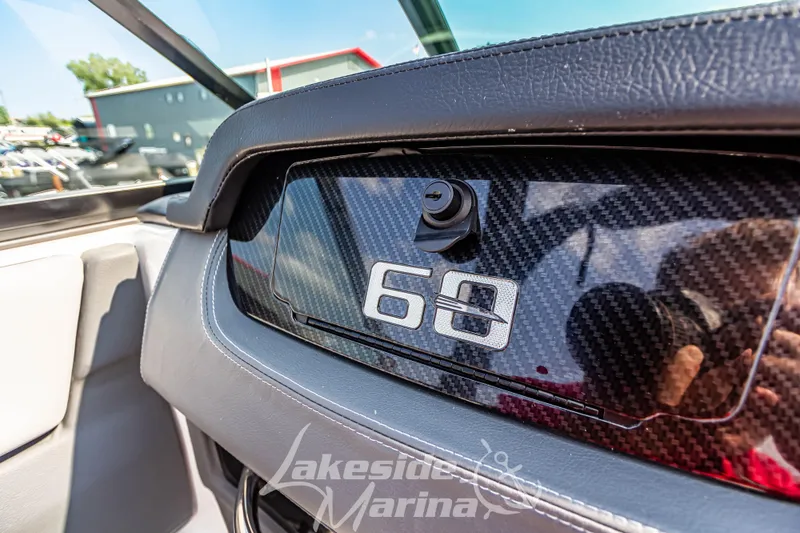 Slide: The Image of 2026 Chaparral SSX 6 dashboard with carbon fiber finish at Lakeside Marina. - 22