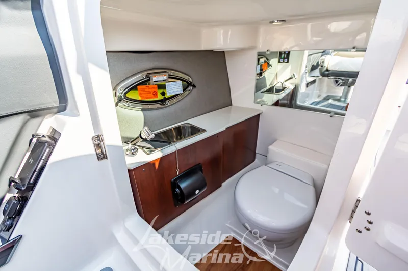 Slide: The Image of 2026 Chaparral SSX 6 boat interior with sink and toilet, featuring modern amenities. - 23