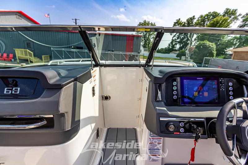Slide: The Image of 2026 Chaparral SSX 6 boat dashboard with modern controls and navigation display. - 28
