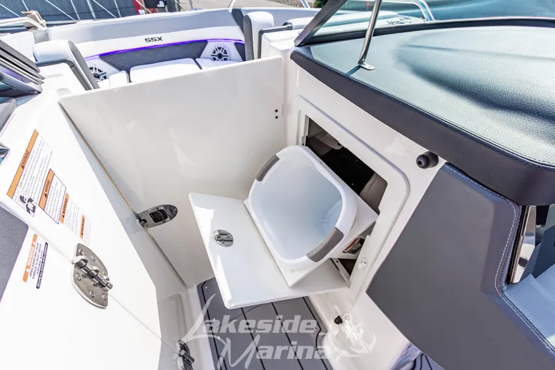 Slide: The Image of 2026 Chaparral SSX 6 boat interior with storage compartment and seating. - 29