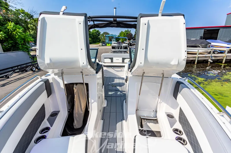 Slide: The Image of 2026 Chaparral SSX 6 boat interior with open storage compartments and sleek seating design. - 34