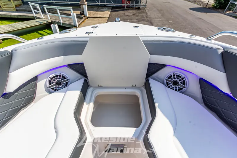 Slide: The Image of 2026 Chaparral SSX 6 boat interior with cushioned seating and built-in speakers. - 36