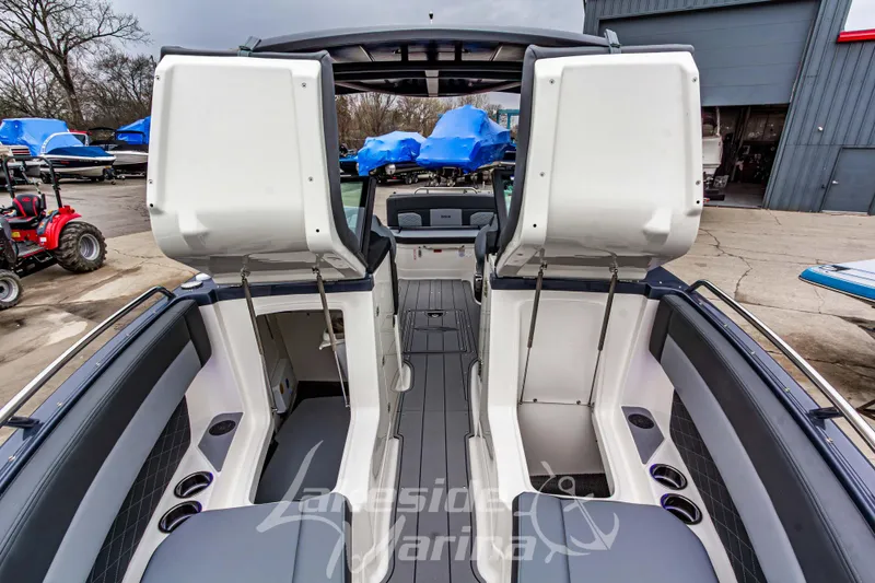 Slide: The Image of 2026 Chaparral SSX 6 boat interior with seating, speakers, and storage compartment. - 38