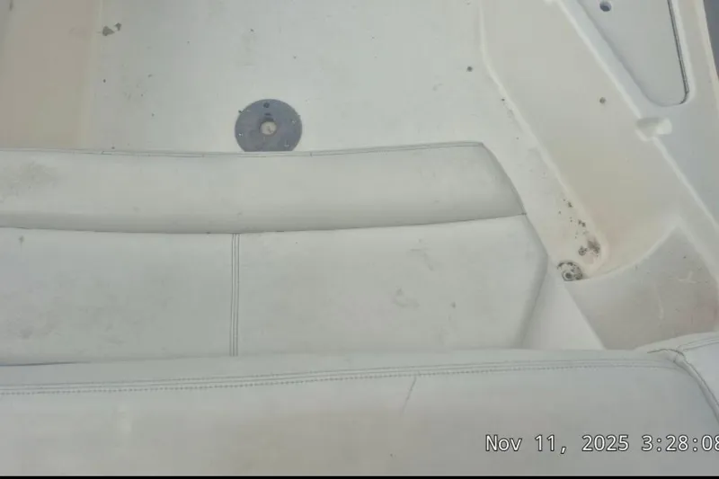 Slide: The Image of Interior of a 2008 Larson LXi 268 boat with white seating and flooring. - 4