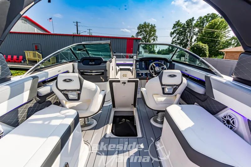 Slide: The Image of 2026 Chaparral SSX 6 boat interior with modern seating and dashboard, showcasing luxury design. - 13