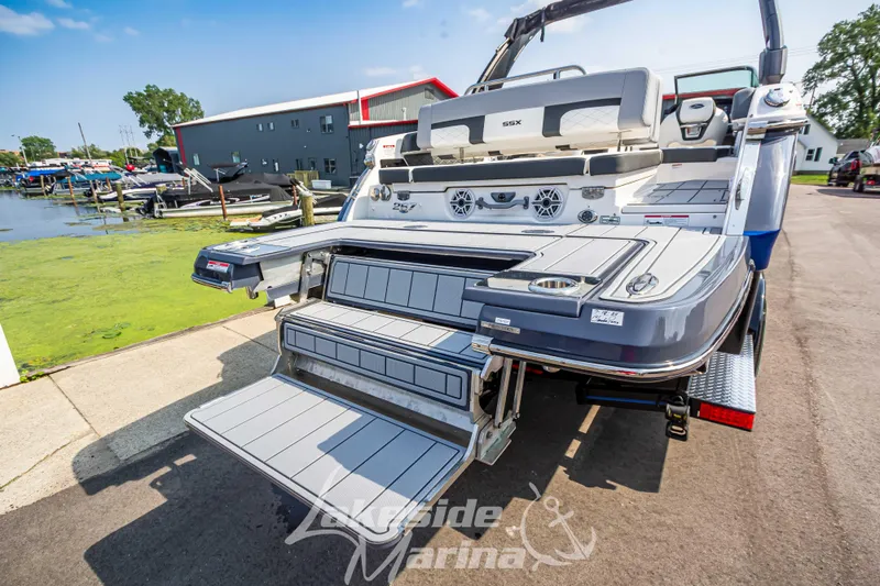 Slide: The Image of 2026 Chaparral SSX 6 boat with extended swim platform at marina. - 14