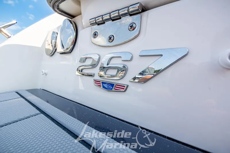 Slide: The Image of Close-up of Chaparral SSX 6 boat emblem, model year 2026, with "267" badge. - 17