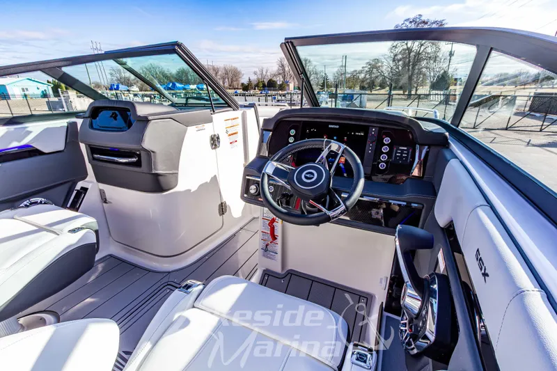 Slide: The Image of 2026 Chaparral SSX 6 boat interior with modern dashboard and steering wheel. - 22