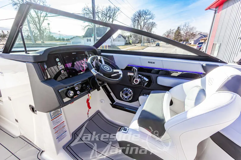 Slide: The Image of 2026 Chaparral SSX 6 boat interior with modern dashboard and steering wheel. - 24