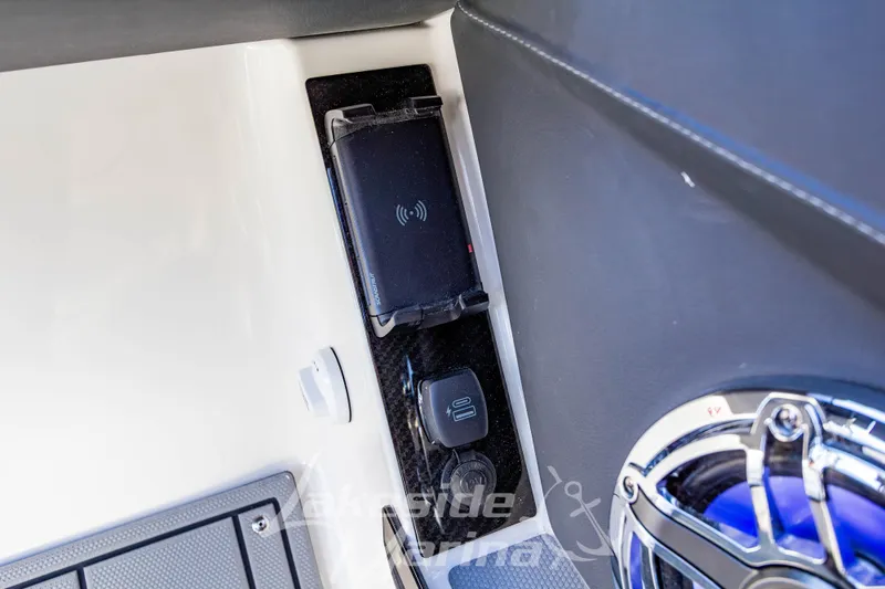 Slide: The Image of 2026 Chaparral SSX 6 boat interior with wireless charging pad and speaker. - 25