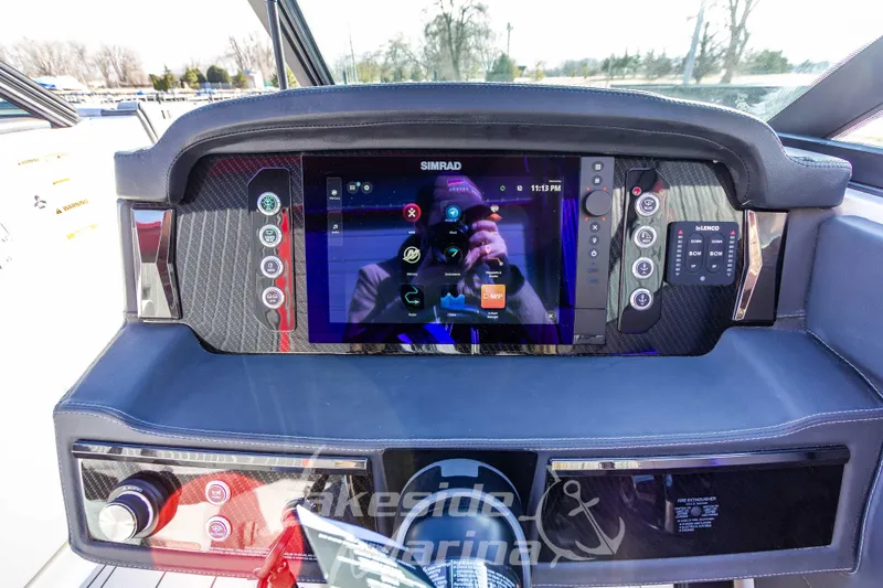 Slide: The Image of 2026 Chaparral SSX 6 dashboard with advanced touchscreen navigation system and controls. - 26