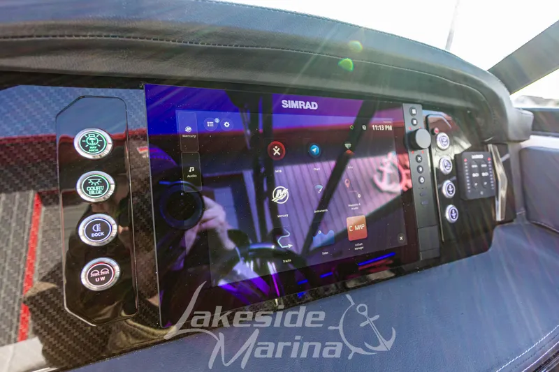 Slide: The Image of Dashboard of 2026 Chaparral SSX 6 boat with Simrad display and controls. - 27