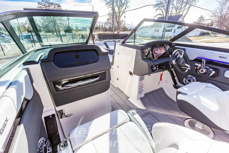 Slide: The Image of 2026 Chaparral SSX 6 boat interior with modern dashboard and seating. - 28