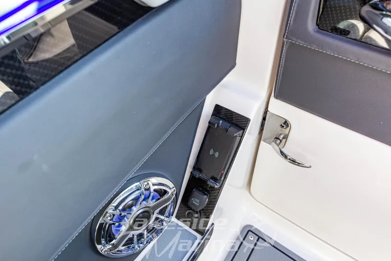 Slide: The Image of 2026 Chaparral SSX 6 interior detail with speaker and wireless charging pad. - 29