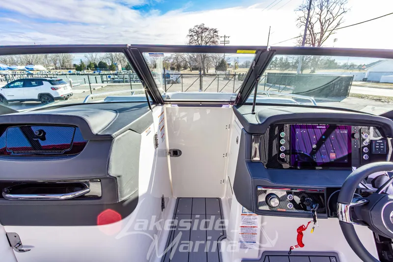 Slide: The Image of 2026 Chaparral SSX 6 boat dashboard with modern controls and navigation system. - 33