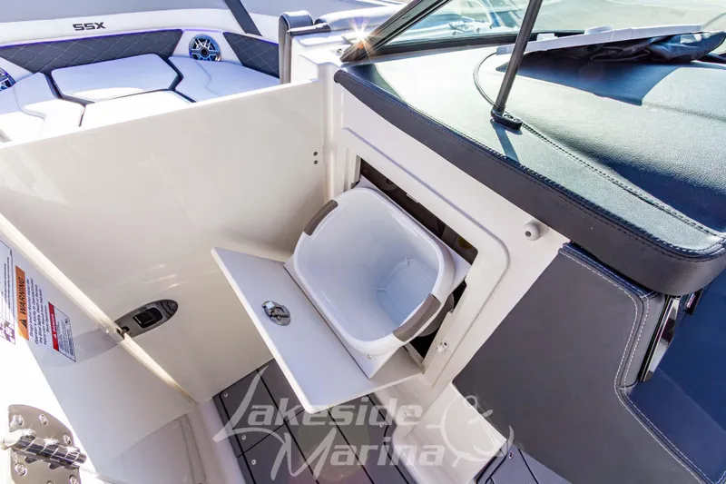 Slide: The Image of 2026 Chaparral SSX 6 boat interior with storage compartment and seating area. - 34