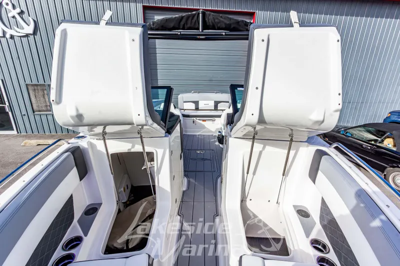 Slide: The Image of 2026 Chaparral SSX 6 boat interior with open storage compartments and seating. - 42