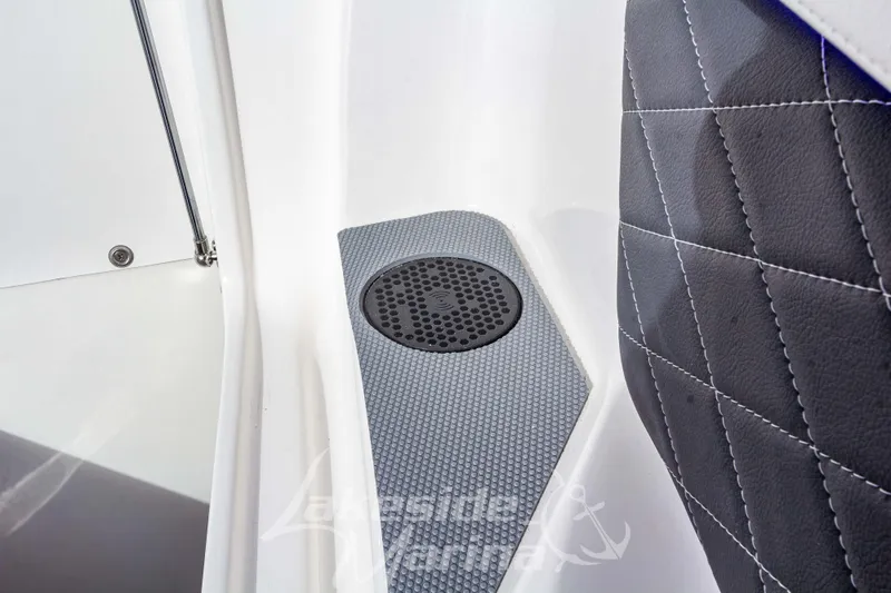 Slide: The Image of 2026 Chaparral SSX 6 boat interior with speaker and quilted seat detail. - 43