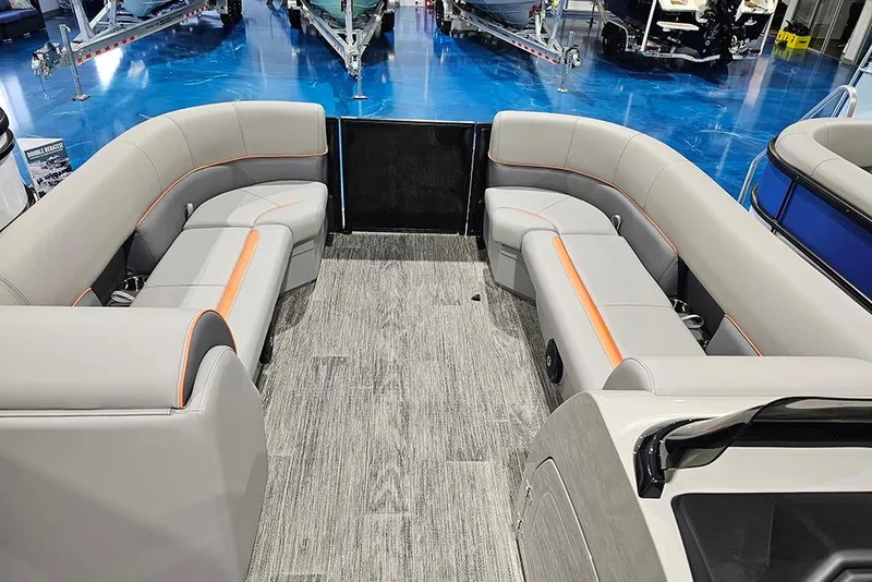 Slide: The Image of 2026 Bentley Pontoons Legacy 243 Swingback interior with gray seating and orange accents. - 18
