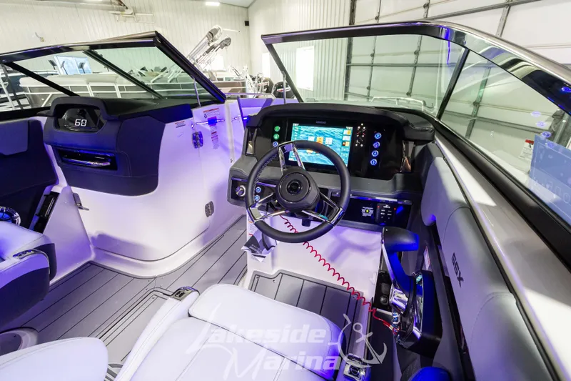 Slide: The Image of 2026 Chaparral SSX 6 boat interior with modern dashboard and steering wheel. - 11