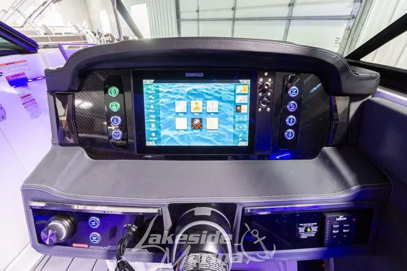 Slide: The Image of Dashboard of 2026 Chaparral SSX 6 boat with advanced Simrad navigation system. - 12