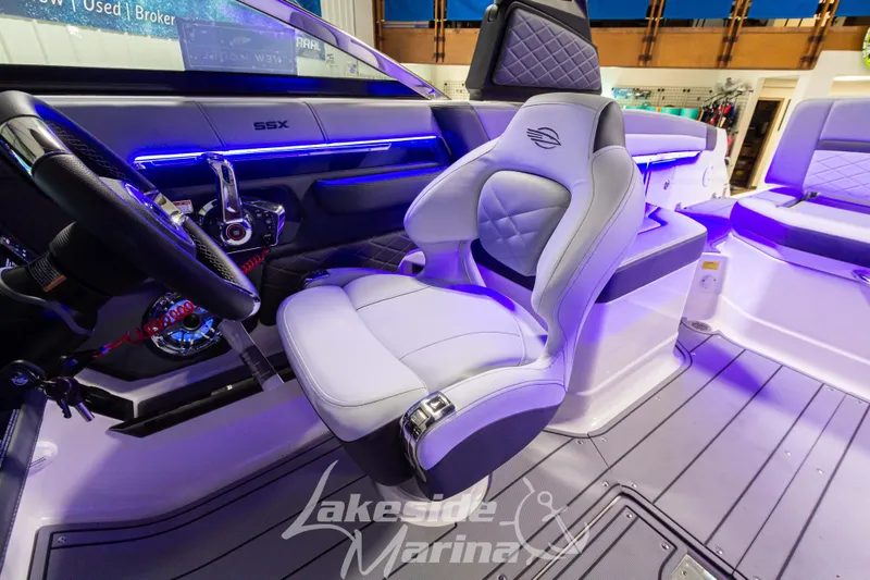Slide: The Image of Interior of 2026 Chaparral SSX 6 boat with modern seating and illuminated dashboard. - 14