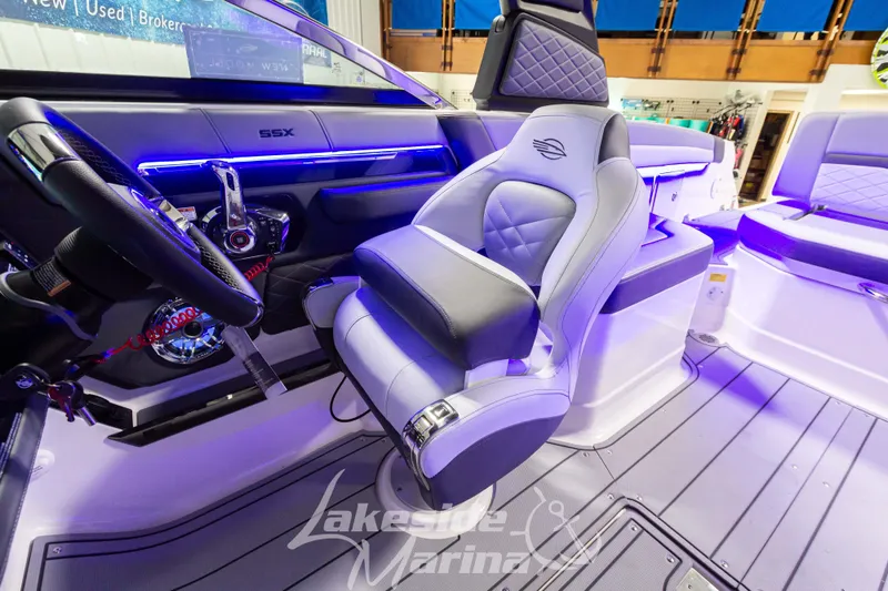 Slide: The Image of Interior of 2026 Chaparral SSX 6 boat with modern seating and illuminated dashboard. - 15