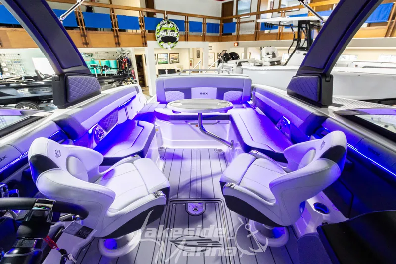 Slide: The Image of Interior of 2026 Chaparral SSX 6 boat with modern seating and ambient lighting. - 18
