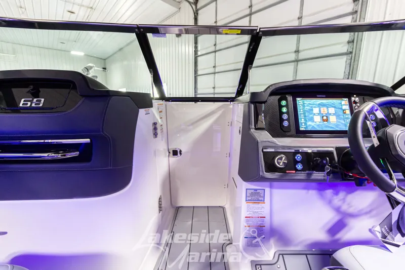 Slide: The Image of 2026 Chaparral SSX 6 boat interior with modern dashboard and steering wheel. - 19