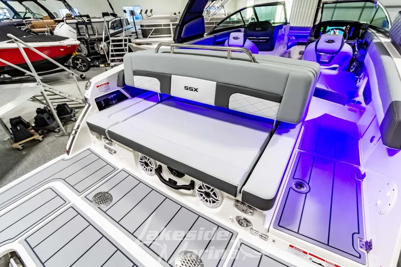 Slide: The Image of 2026 Chaparral SSX 6 boat interior with modern seating and ambient lighting. - 2