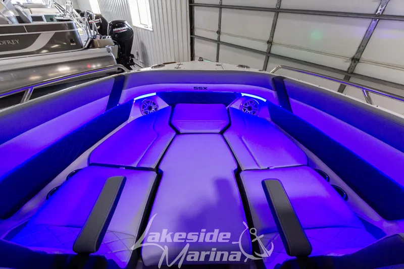 Slide: The Image of 2026 Chaparral SSX 6 boat interior with blue LED lighting and luxurious seating. - 22