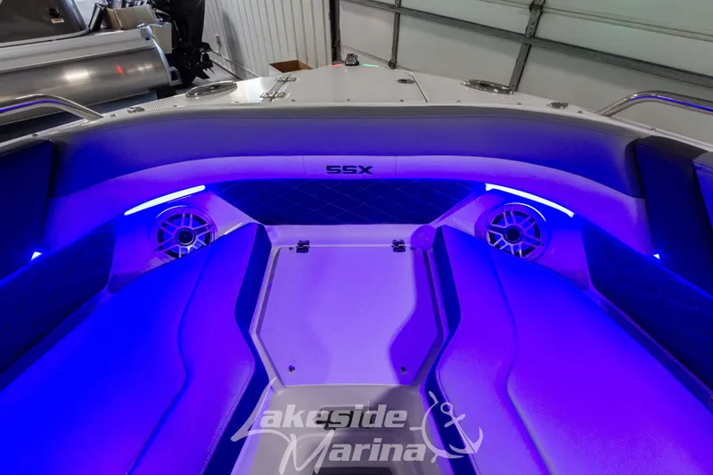 Slide: The Image of Interior of 2026 Chaparral SSX 6 boat with blue LED lighting and speaker system. - 24