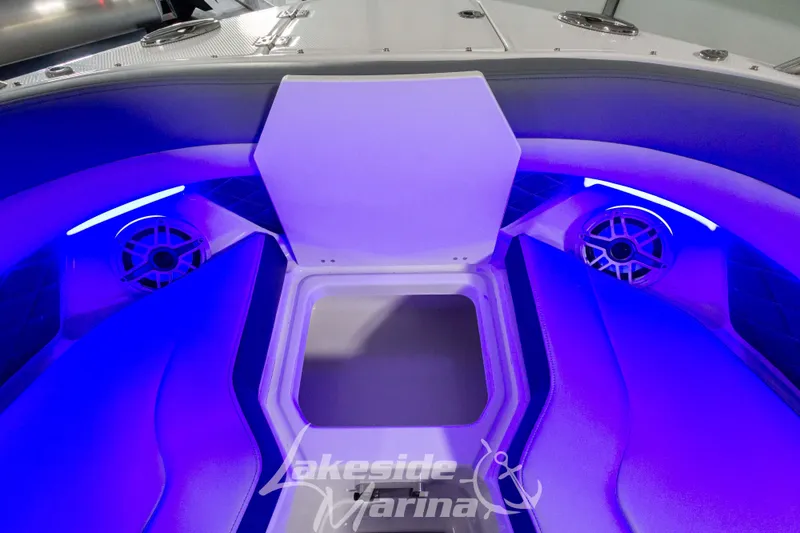 Slide: The Image of Interior of 2026 Chaparral SSX 6 boat with blue LED lighting and speaker system. - 25