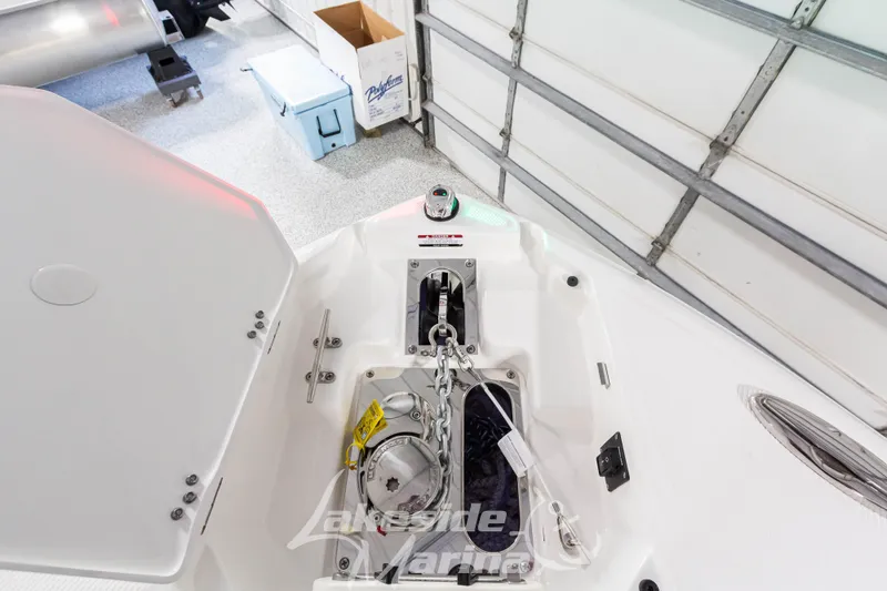 Slide: The Image of 2026 Chaparral SSX 6 boat anchor compartment in a garage setting. - 26