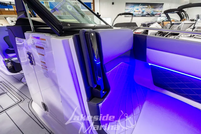 Slide: The Image of 2026 Chaparral SSX 6 boat interior with blue LED lighting at Lakeside Marina. - 27