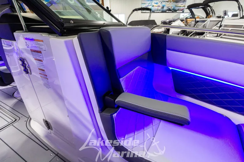 Slide: The Image of 2026 Chaparral SSX 6 boat interior with blue LED lighting and luxurious seating. - 28