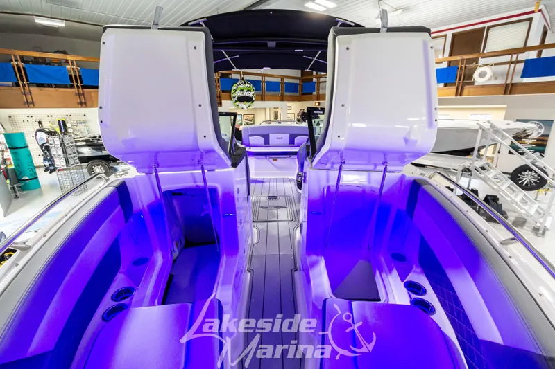 Slide: The Image of 2026 Chaparral SSX 6 boat interior with blue LED lighting at Lakeside Marina. - 29