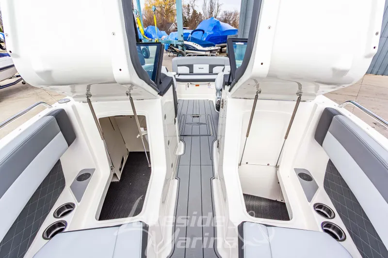 Slide: The Image of 2026 Chaparral SSX 6 boat interior with open storage compartments and sleek seating design. - 34