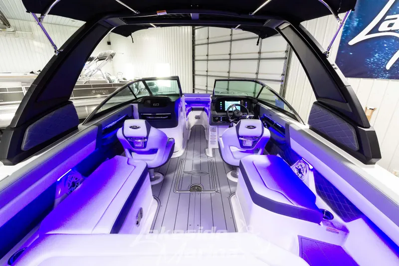 Slide: The Image of 2026 Chaparral SSX 6 boat interior with modern seating and ambient lighting. - 4