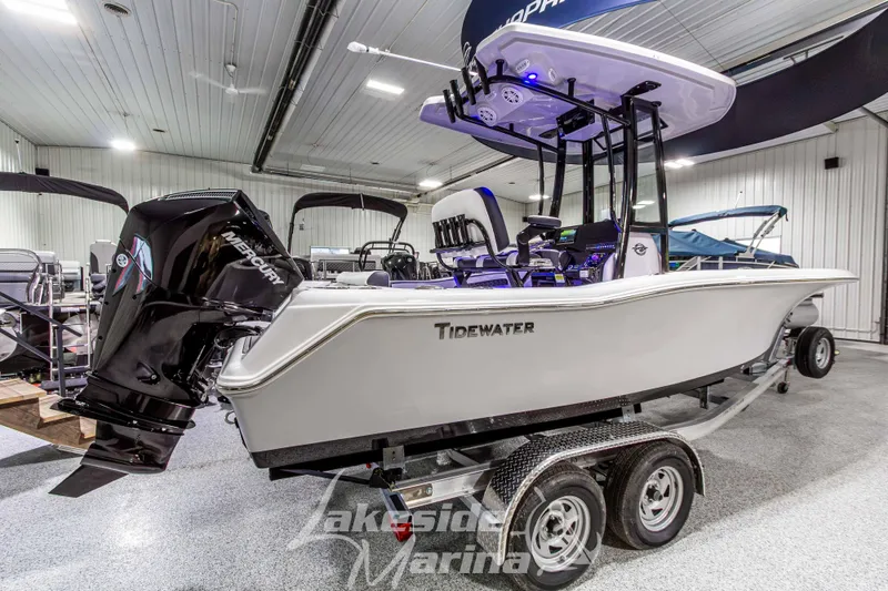 Slide: The Image of 2026 Tidewater 210 CC Adventure boat on trailer in showroom. - 3