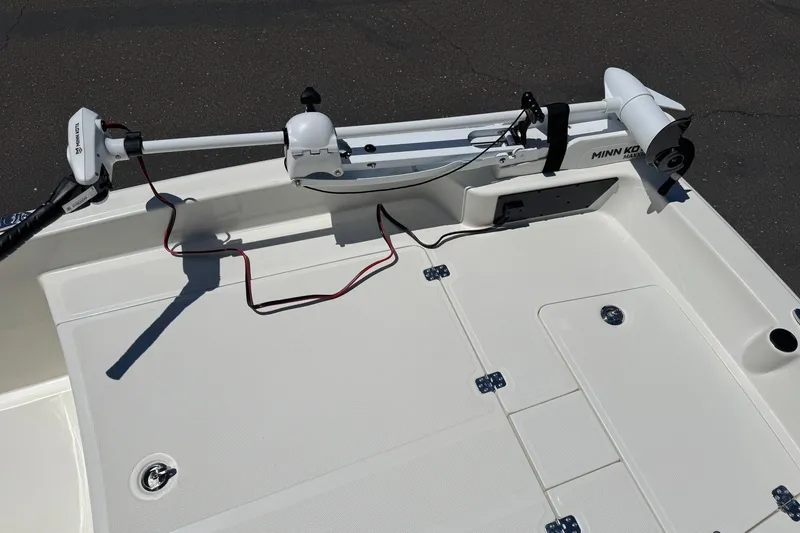 Slide: The Image of 2026 Mako Pro Skiff 17 CC boat deck with Minn Kota trolling motor. - 13