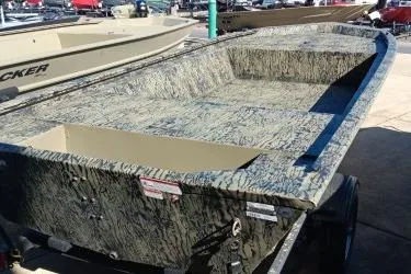 Slide: The Image of 2026 Tracker Grizzly 1648 Utility boat with camouflage design on display. - 2