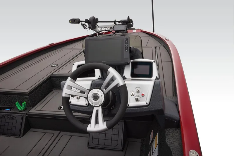 Slide: The Image of Open storage compartment in 2026 Tracker Savage 215 boat, showing equipment and accessories. - 26