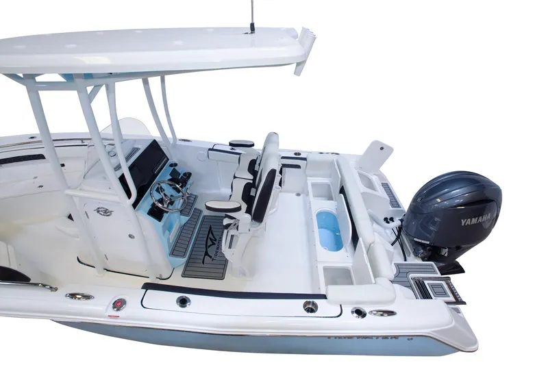 Slide: The Image of 2026 Tidewater 220 LXF boat interior with Yamaha engine, featuring modern seating and controls. - 10