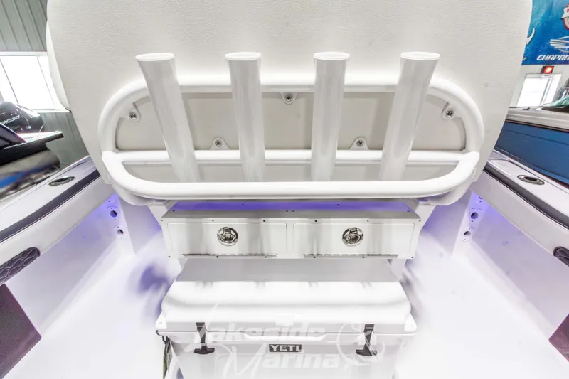Slide: The Image of 2026 Tidewater 220 LXF boat interior with rod holders and storage compartment. - 18