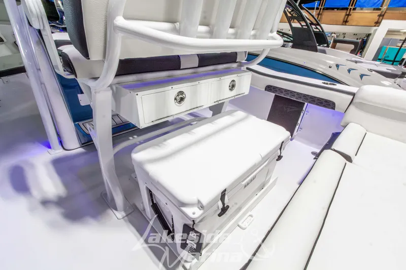 Slide: The Image of 2026 Tidewater 220 LXF boat interior with seating and storage compartments. - 22