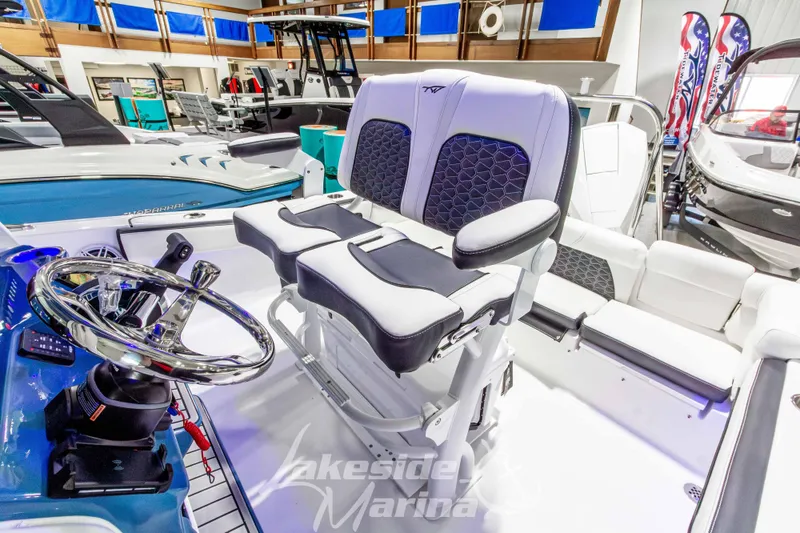 Slide: The Image of 2026 Tidewater 220 LXF boat interior with modern helm and seating at Lakeside Marina. - 29