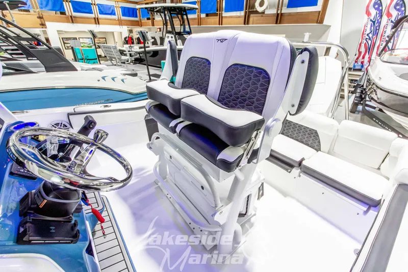 Slide: The Image of 2026 Tidewater 220 LXF boat interior with modern helm and seating at Lakeside Marina. - 30