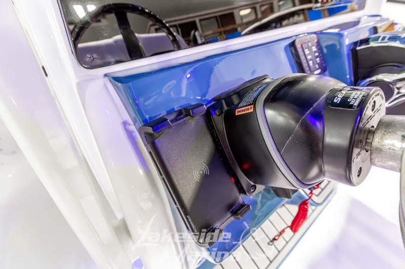 Slide: The Image of 2026 Tidewater 220 LXF boat dashboard with advanced steering and control features. - 33